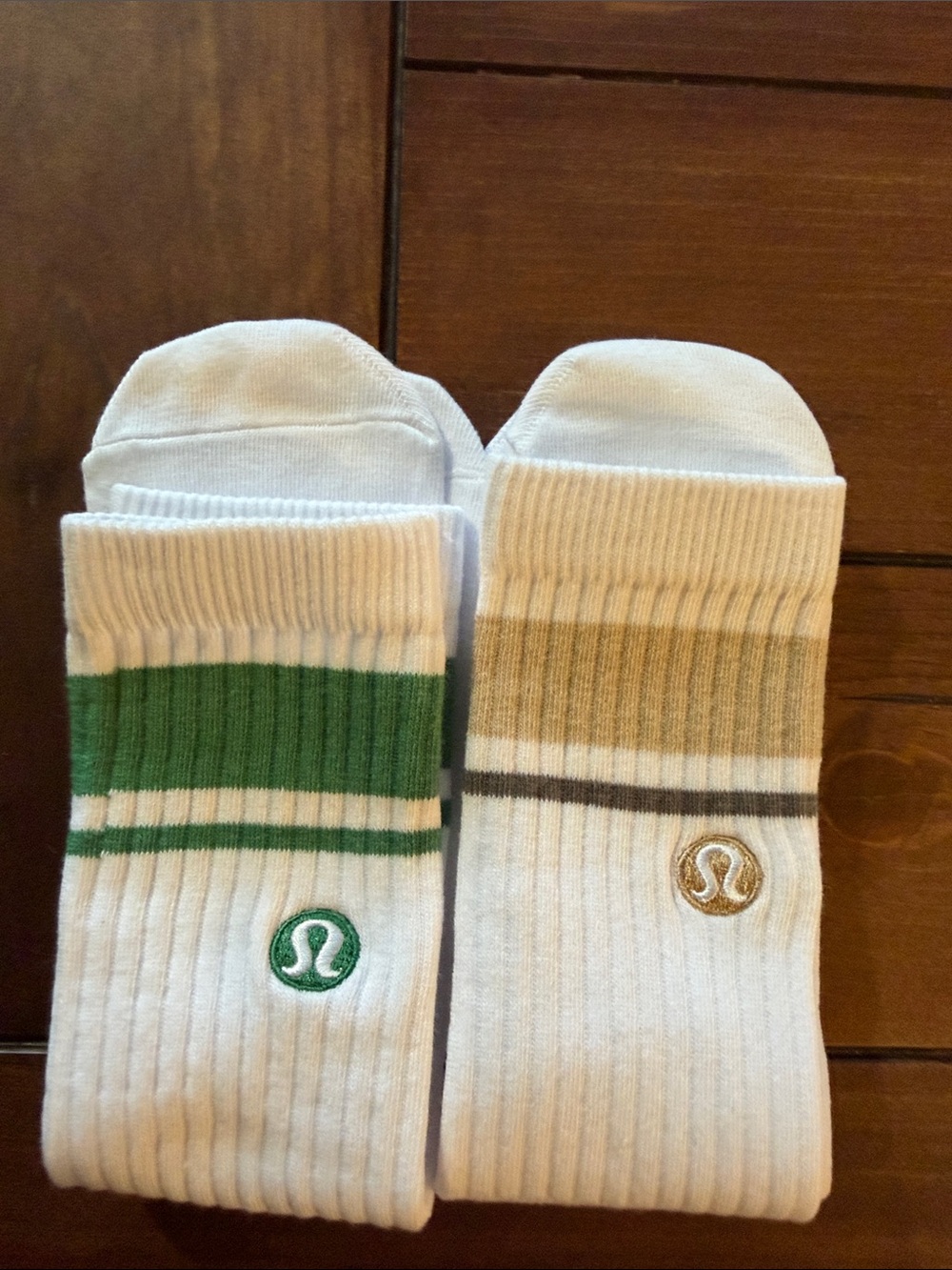 Lululemon unisex White Crew Socks with Green Stripes and one with Tan Stripes